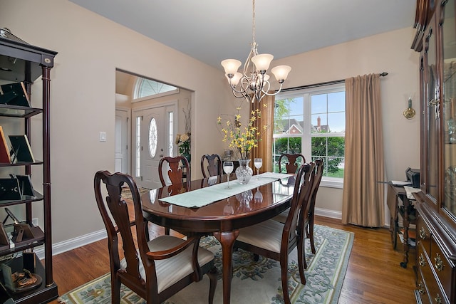 318 Maple St, Beecher, IL 60401 - dining area with a chandelier, wood finished floors, and baseboards