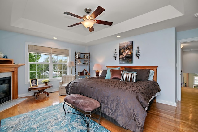 318 Maple St, Beecher, IL 60401 - bedroom with a raised ceiling, wood finished floors, a premium fireplace, baseboards, and recessed lighting