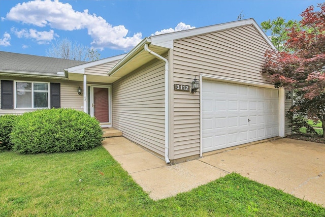 3112 Valerie Dr, Champaign, IL 61822 - view of side of property with a garage and a yard
