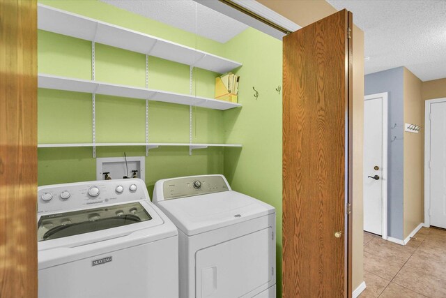 3112 Valerie Dr, Champaign, IL 61822 - laundry area with separate washer and dryer, a textured ceiling, and light tile patterned floors