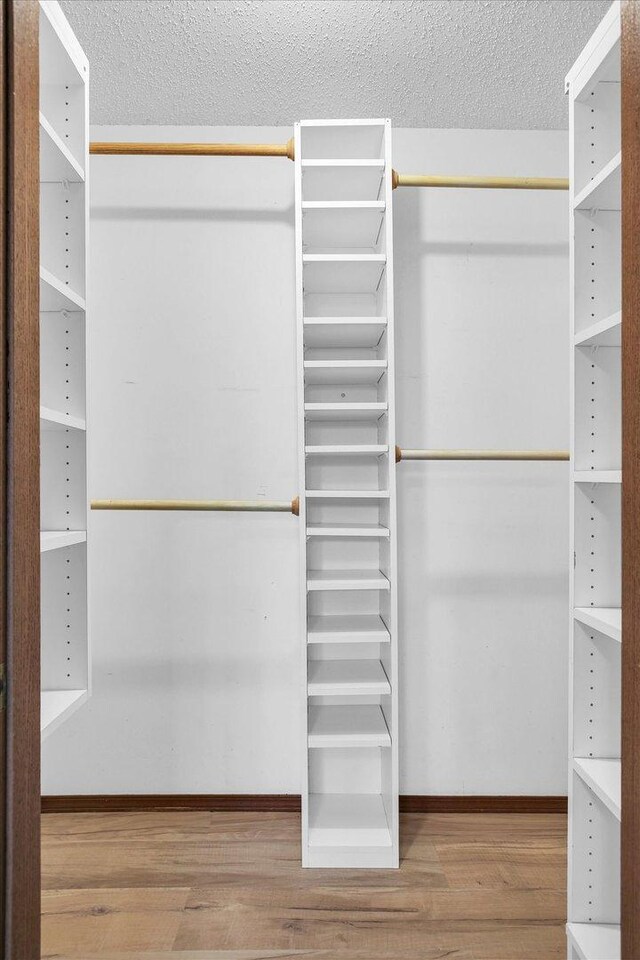 3112 Valerie Dr, Champaign, IL 61822 - walk in closet featuring wood finished floors