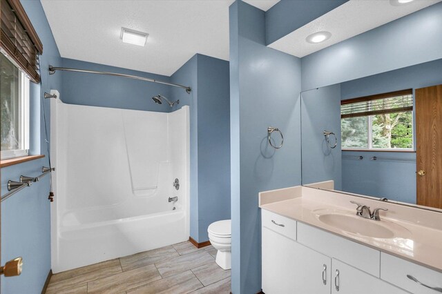 3112 Valerie Dr, Champaign, IL 61822 - bathroom with bathing tub / shower combination, vanity, and wood tiled floors