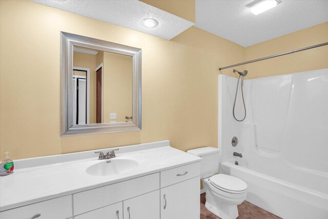 3112 Valerie Dr, Champaign, IL 61822 - bathroom with a textured ceiling, vanity, and bathing tub / shower combination