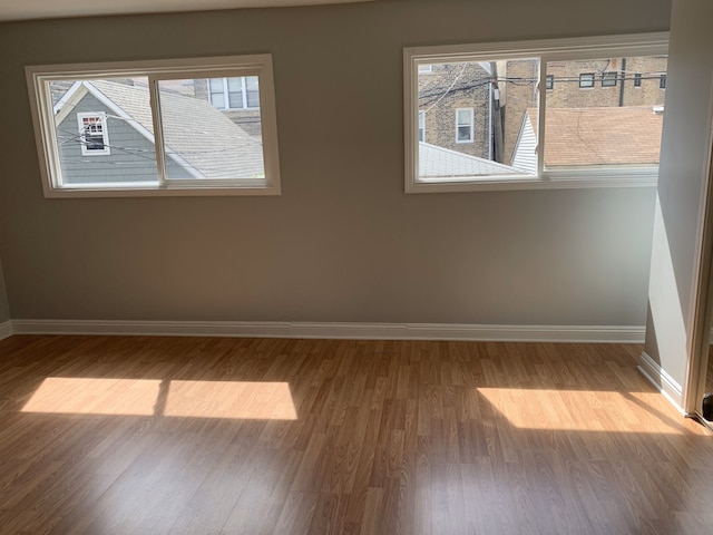 1842 N Paulina St, Chicago, IL 60622 - empty room featuring baseboards and wood finished floors