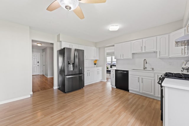 413 Caren Dr, Buffalo Grove, IL 60089 - kitchen featuring appliances with stainless steel finishes, a sink, tasteful backsplash, light countertops, and light wood finished floors