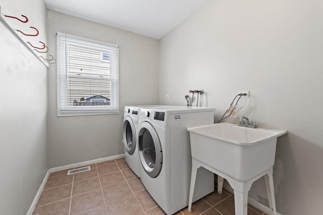 413 Caren Dr, Buffalo Grove, IL 60089 - laundry area with light tile patterned floors, baseboards, and washing machine and dryer
