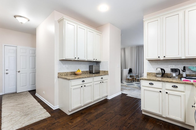 2899 Church Rd, Aurora, IL 60502 - kitchen featuring tasteful backsplash, dark wood-type flooring, baseboards, light stone countertops, and white cabinetry
