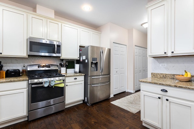 2899 Church Rd, Aurora, IL 60502 - kitchen with appliances with stainless steel finishes, dark wood-style floors, backsplash, and light stone countertops