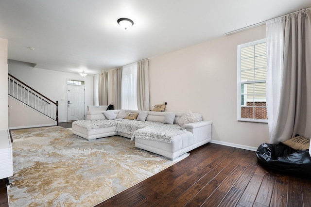 2899 Church Rd, Aurora, IL 60502 - living area featuring dark wood-style flooring, baseboards, and stairs