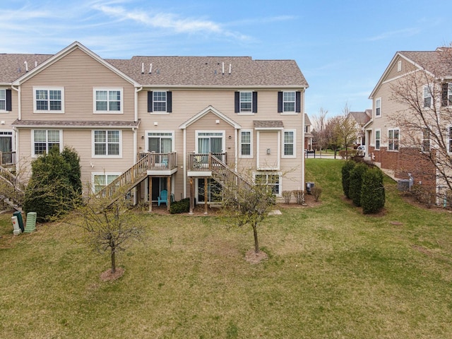 2899 Church Rd, Aurora, IL 60502 - rear view of house featuring stairway, a wooden deck, and a lawn