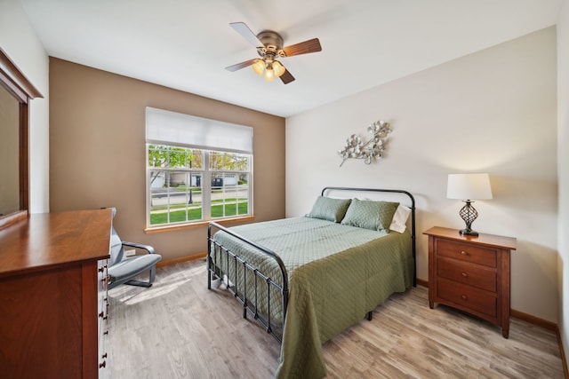 1468 W Remington Ln, Round Lake, IL 60073 - bedroom with baseboards, wood finished floors, and ceiling fan