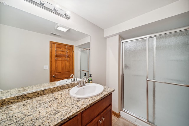 1468 W Remington Ln, Round Lake, IL 60073 - bathroom featuring a shower stall, vanity, and tile patterned flooring