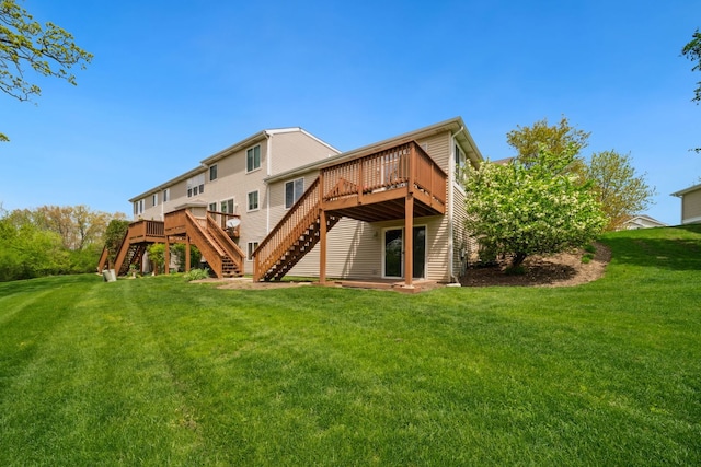 1468 W Remington Ln, Round Lake, IL 60073 - rear view of property featuring stairway, a wooden deck, and a lawn