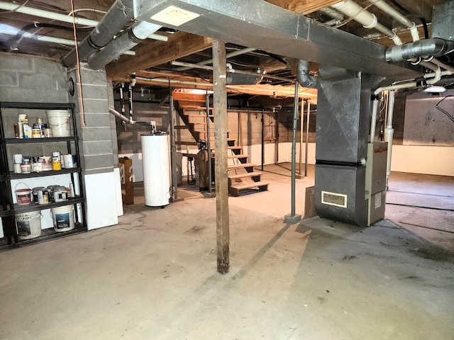unfinished below grade area with gas water heater, heating unit, and stairway