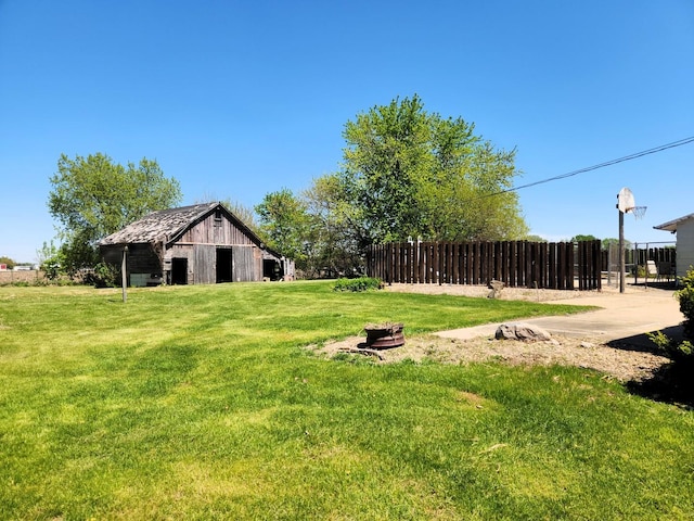 view of yard with a barn and an outdoor structure