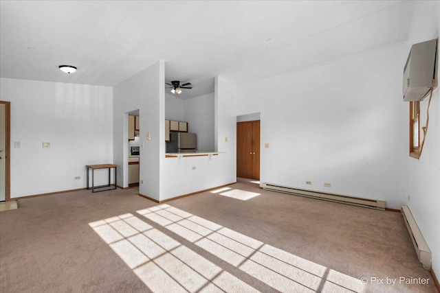 unfurnished living room featuring light carpet, baseboard heating, ceiling fan, and a wall mounted AC