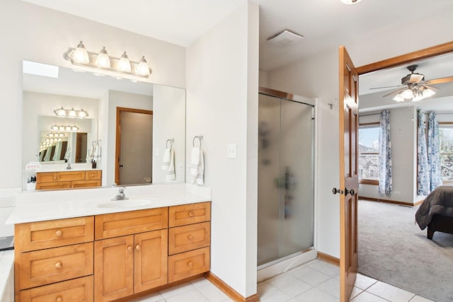 24725 Hanover Ct, Plainfield, IL 60585 - ensuite bathroom featuring a stall shower, vanity, a ceiling fan, baseboards, and tile patterned flooring