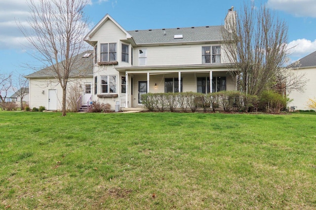 24725 Hanover Ct, Plainfield, IL 60585 - view of front of house with entry steps, a front yard, and a chimney