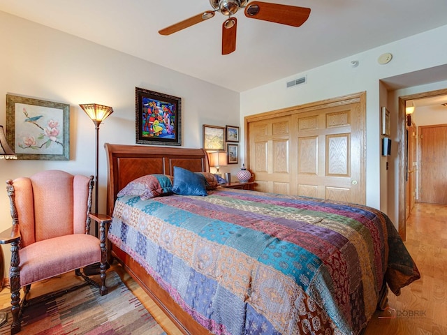 5 W Central Rd Unit 512, Mount Prospect, IL 60056 - bedroom with wood finished floors, a closet, and a ceiling fan