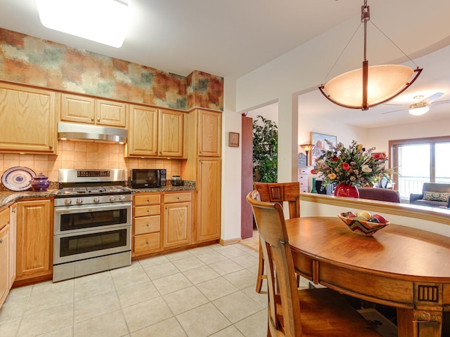 5 W Central Rd Unit 512, Mount Prospect, IL 60056 - kitchen with double oven range, under cabinet range hood, tasteful backsplash, black microwave, and light brown cabinetry