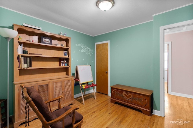 827 Lakewood Pl, Aurora, IL 60506 - sitting room with ornamental molding, wood finished floors, and baseboards