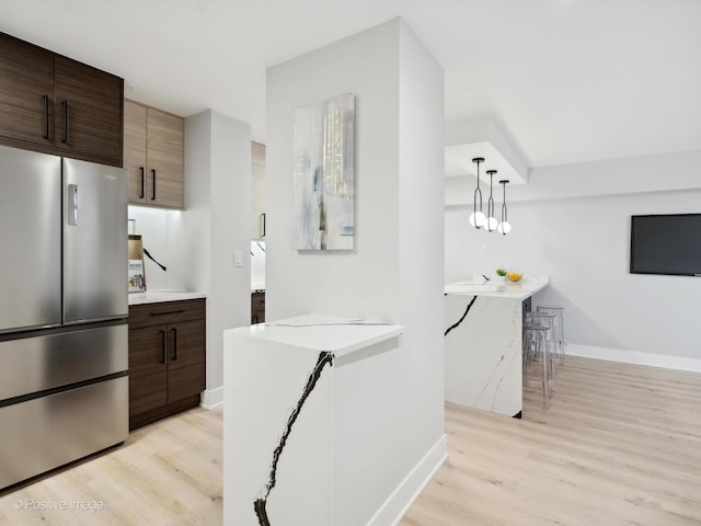 4250 N Marine Dr Unit 1929, Chicago, IL 60613 - kitchen with freestanding refrigerator, baseboards, and light wood-type flooring