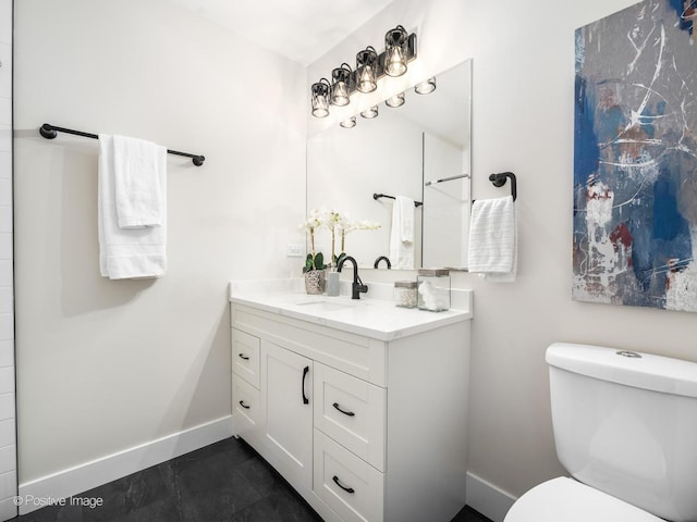 full bathroom featuring baseboards, toilet, and vanity