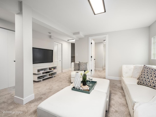 living room with light colored carpet and baseboards
