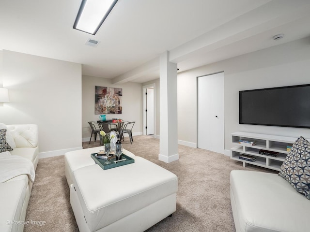 living room featuring light colored carpet and baseboards