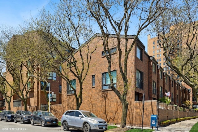 view of building exterior featuring fence