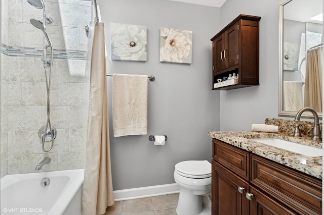 full bathroom with tile patterned flooring, baseboards, vanity, shower / tub combo, and toilet