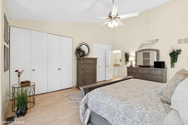 bedroom with light wood-style flooring, high vaulted ceiling, a closet, and a ceiling fan