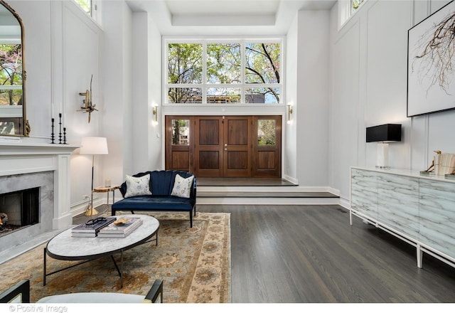 1241 W Dickens Ave, Chicago, IL 60614 - living room with wood finished floors, a towering ceiling, a fireplace, and baseboards