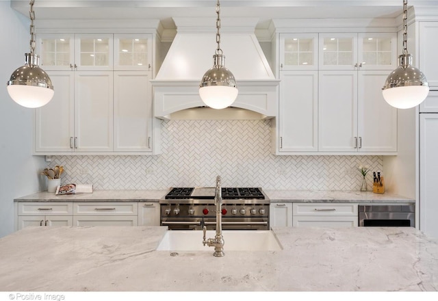 1241 W Dickens Ave, Chicago, IL 60614 - kitchen featuring range with two ovens, white cabinets, custom range hood, and glass insert cabinets