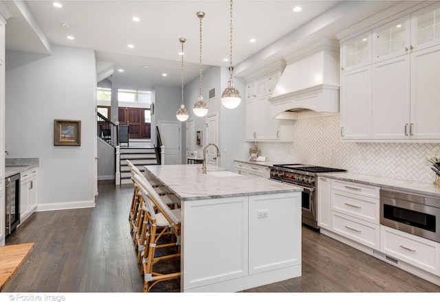 1241 W Dickens Ave, Chicago, IL 60614 - kitchen with double oven range, premium range hood, wine cooler, a sink, and white cabinets