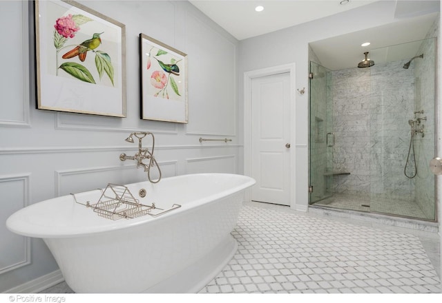 1241 W Dickens Ave, Chicago, IL 60614 - bathroom with a shower stall, a freestanding bath, a decorative wall, and recessed lighting