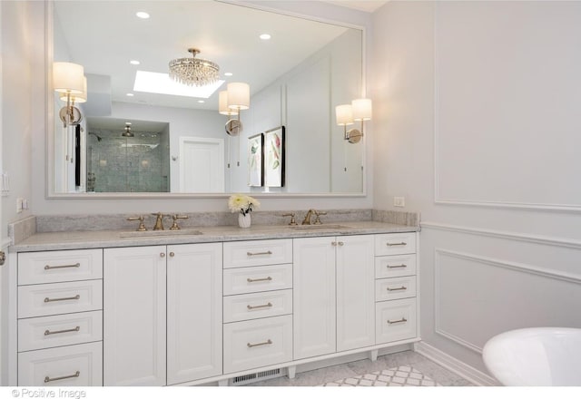 1241 W Dickens Ave, Chicago, IL 60614 - bathroom with a stall shower, double vanity, and recessed lighting