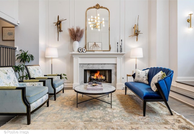 1241 W Dickens Ave, Chicago, IL 60614 - sitting room with a fireplace, wood finished floors, a chandelier, and baseboards