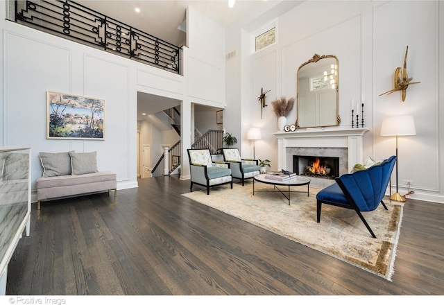 1241 W Dickens Ave, Chicago, IL 60614 - living area with wood finished floors, stairway, a towering ceiling, and a high end fireplace