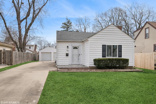 19 N Iowa Ave, Addison, IL 60101 - view of front of property featuring an outbuilding, a detached garage, and a shingled roof