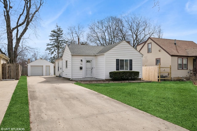 19 N Iowa Ave, Addison, IL 60101 - view of front facade featuring an outbuilding, a garage, and a shingled roof