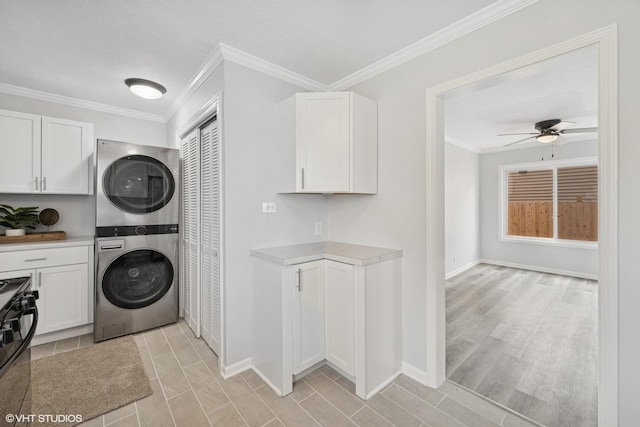 19 N Iowa Ave, Addison, IL 60101 - laundry room featuring stacked washing machine and dryer, crown molding, a ceiling fan, baseboards, and a textured ceiling