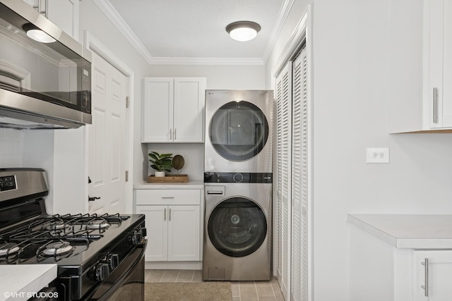 19 N Iowa Ave, Addison, IL 60101 - kitchen featuring appliances with stainless steel finishes, stacked washer and clothes dryer, white cabinets, and ornamental molding