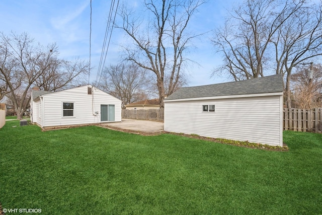 19 N Iowa Ave, Addison, IL 60101 - view of yard featuring an outbuilding and a patio