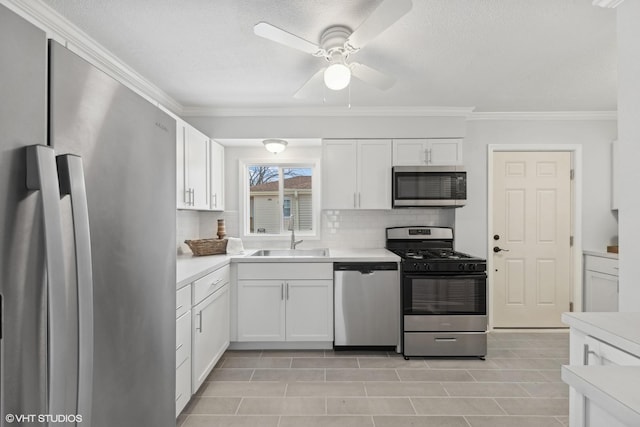 19 N Iowa Ave, Addison, IL 60101 - kitchen featuring appliances with stainless steel finishes, a sink, crown molding, light countertops, and a textured ceiling