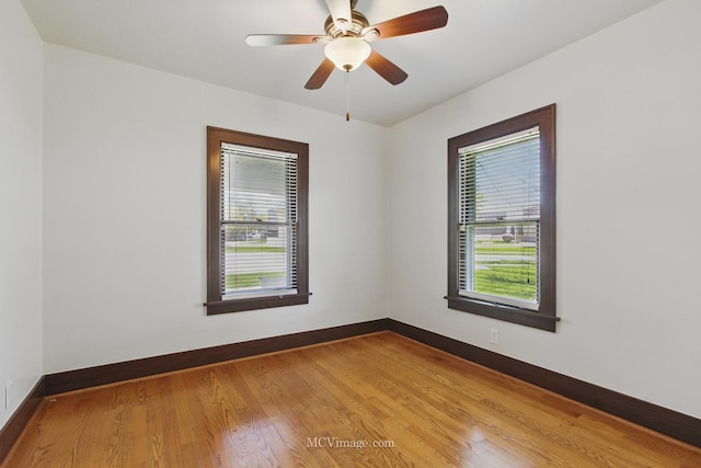 137 E Tyler St, Oswego, IL 60543 - unfurnished room with healthy amount of natural light, baseboards, and wood finished floors