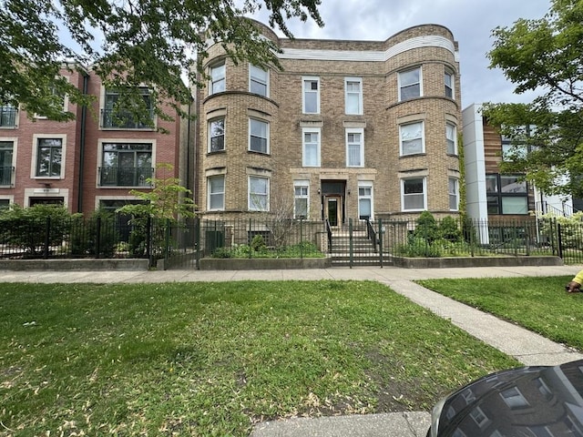 6116 S Ellis Ave Unit 1, Chicago, IL 60637 - view of building exterior featuring a fenced front yard