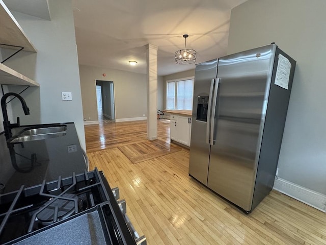 6116 S Ellis Ave Unit 1, Chicago, IL 60637 - kitchen with stainless steel fridge with ice dispenser, a sink, white cabinets, light wood-style floors, and baseboards