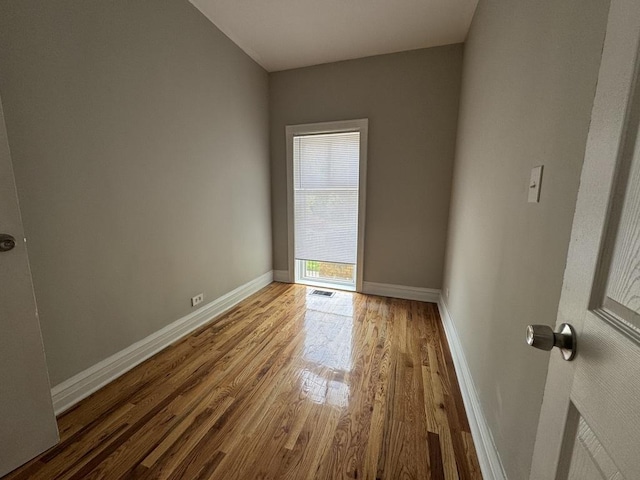 6116 S Ellis Ave Unit 1, Chicago, IL 60637 - unfurnished room with wood finished floors and baseboards