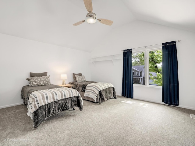 bedroom with carpet floors, vaulted ceiling, ceiling fan, and baseboards